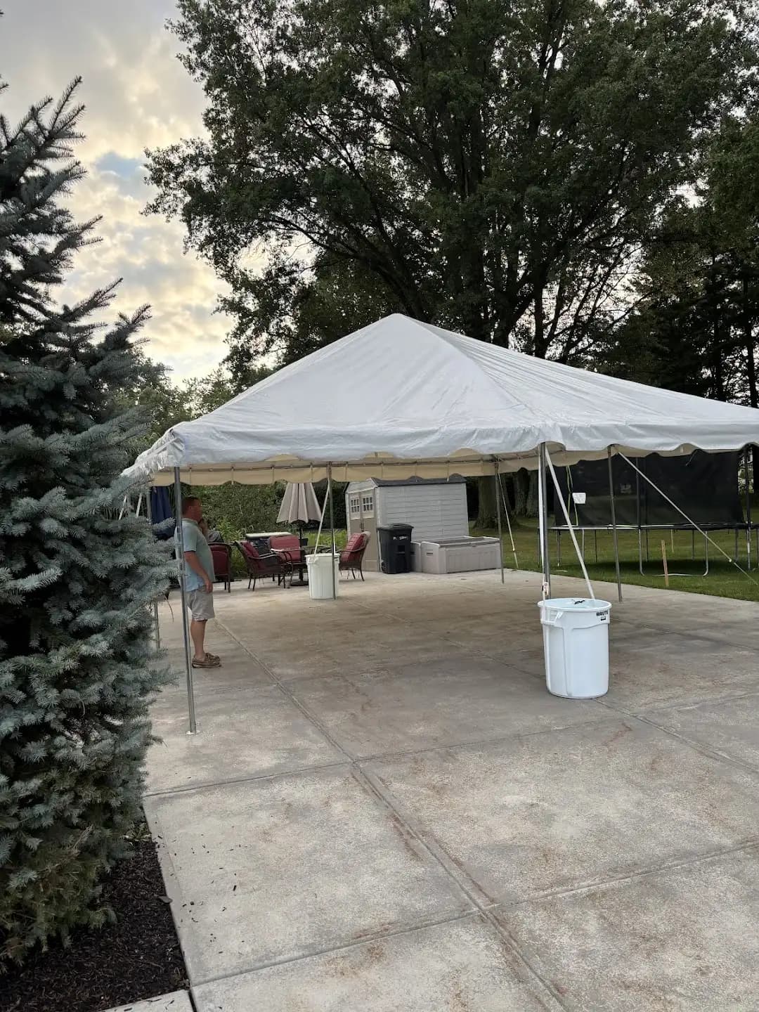 White event tent set up on a backyard patio in Independence, installed by Shoreline