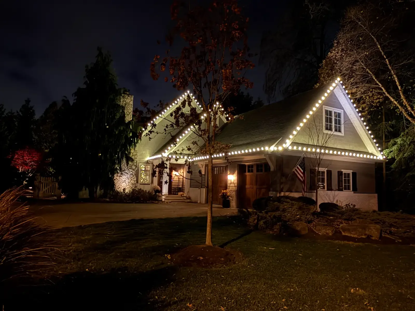 Side view of the illuminated home in Avon Lake, a Shoreline project