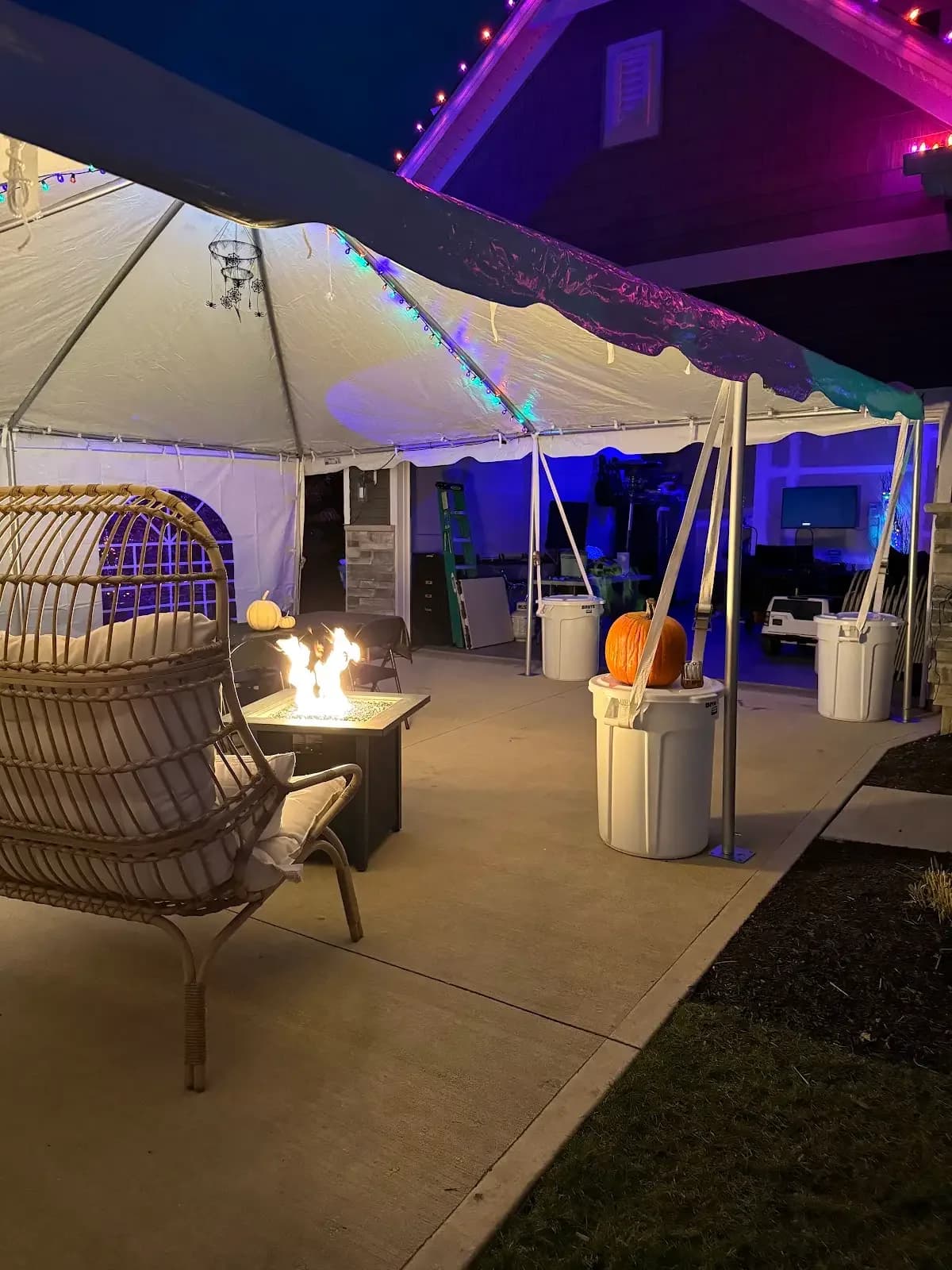 Tent setup beside the illuminated home in Avon Lake, a Shoreline project