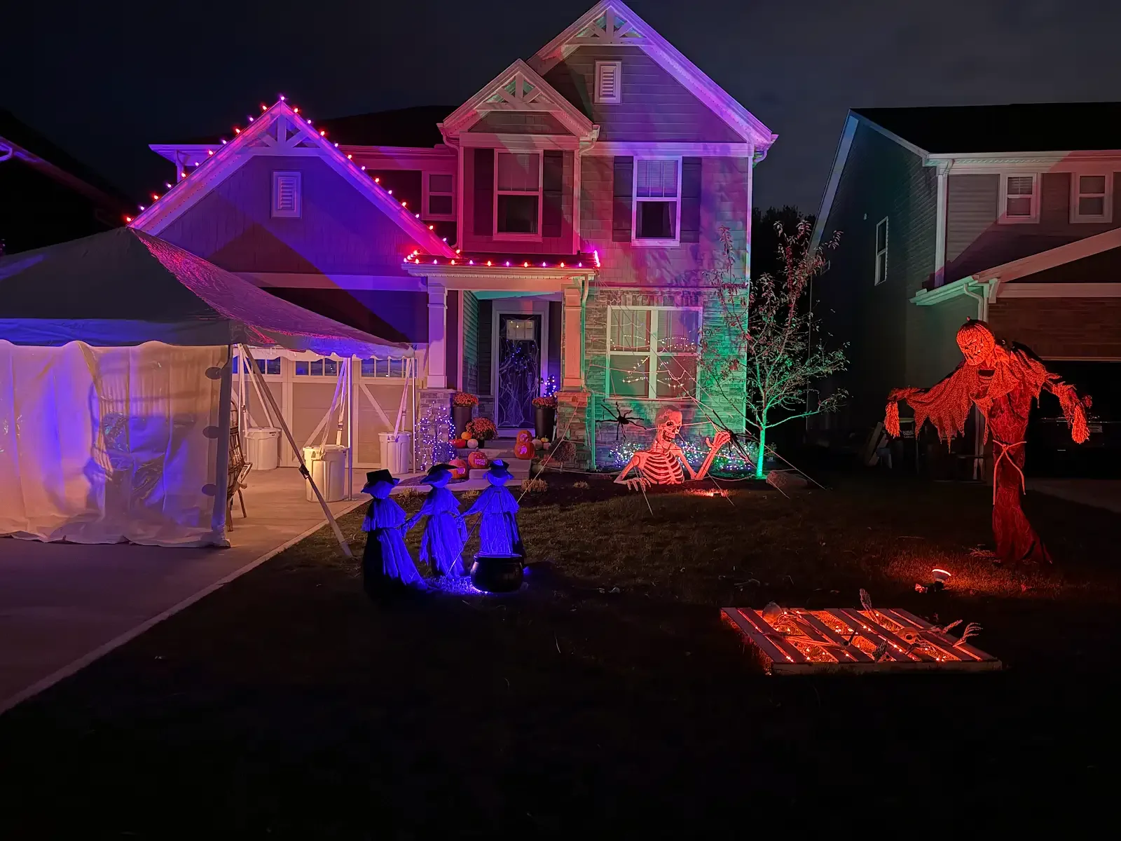 Tent beside a home with colorful lighting in Avon Lake, a Shoreline project