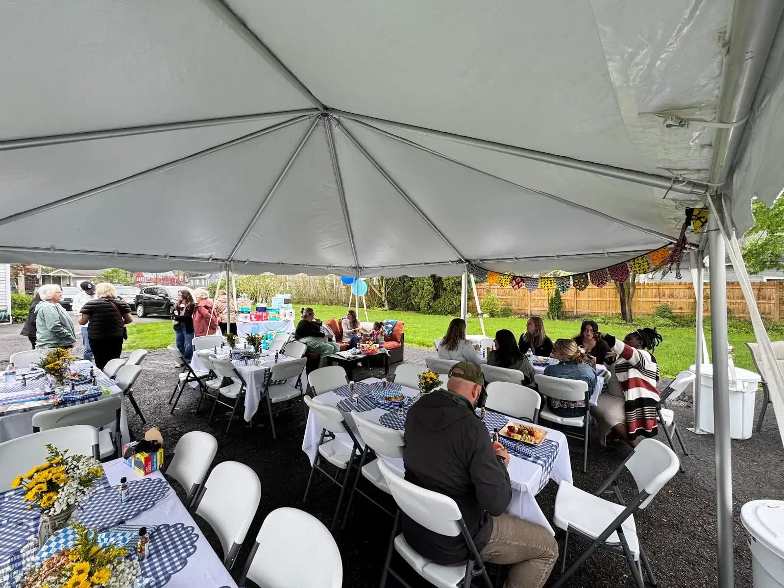 Guest seating beneath the event tent in Avon Lake, a Shoreline project