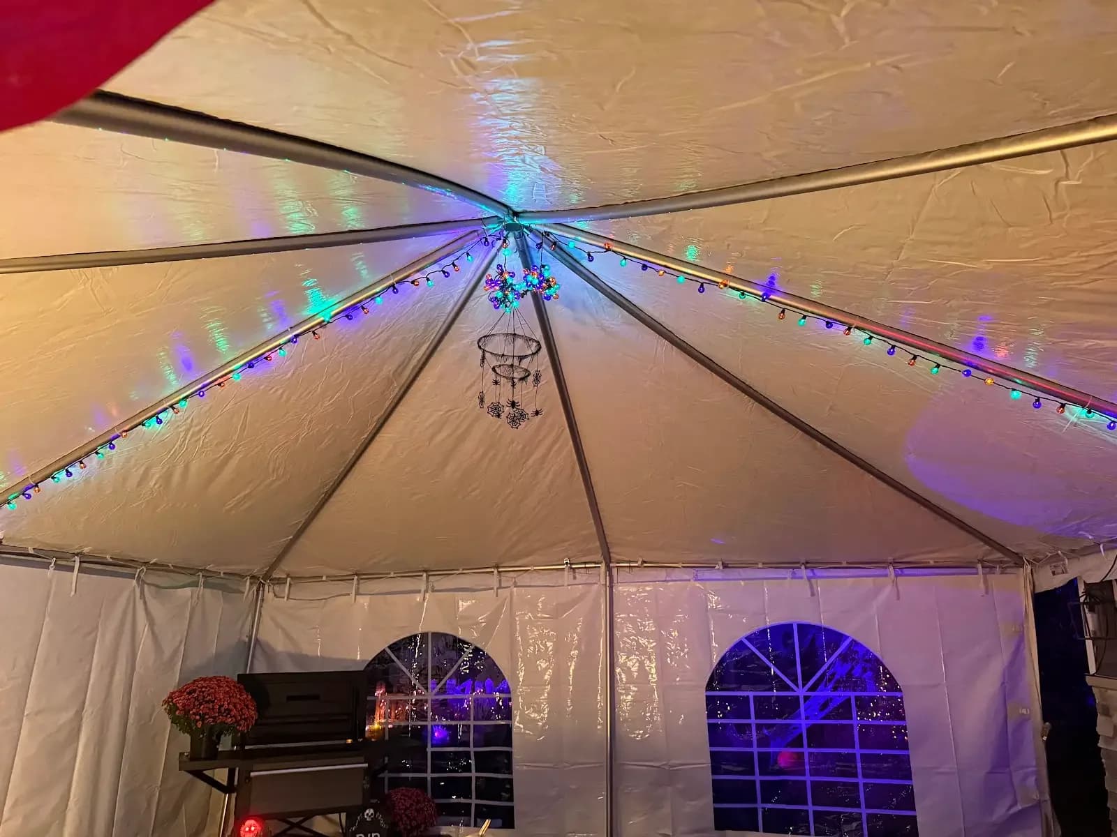 Colored lighting beneath the tent canopy in Avon Lake, a Shoreline project