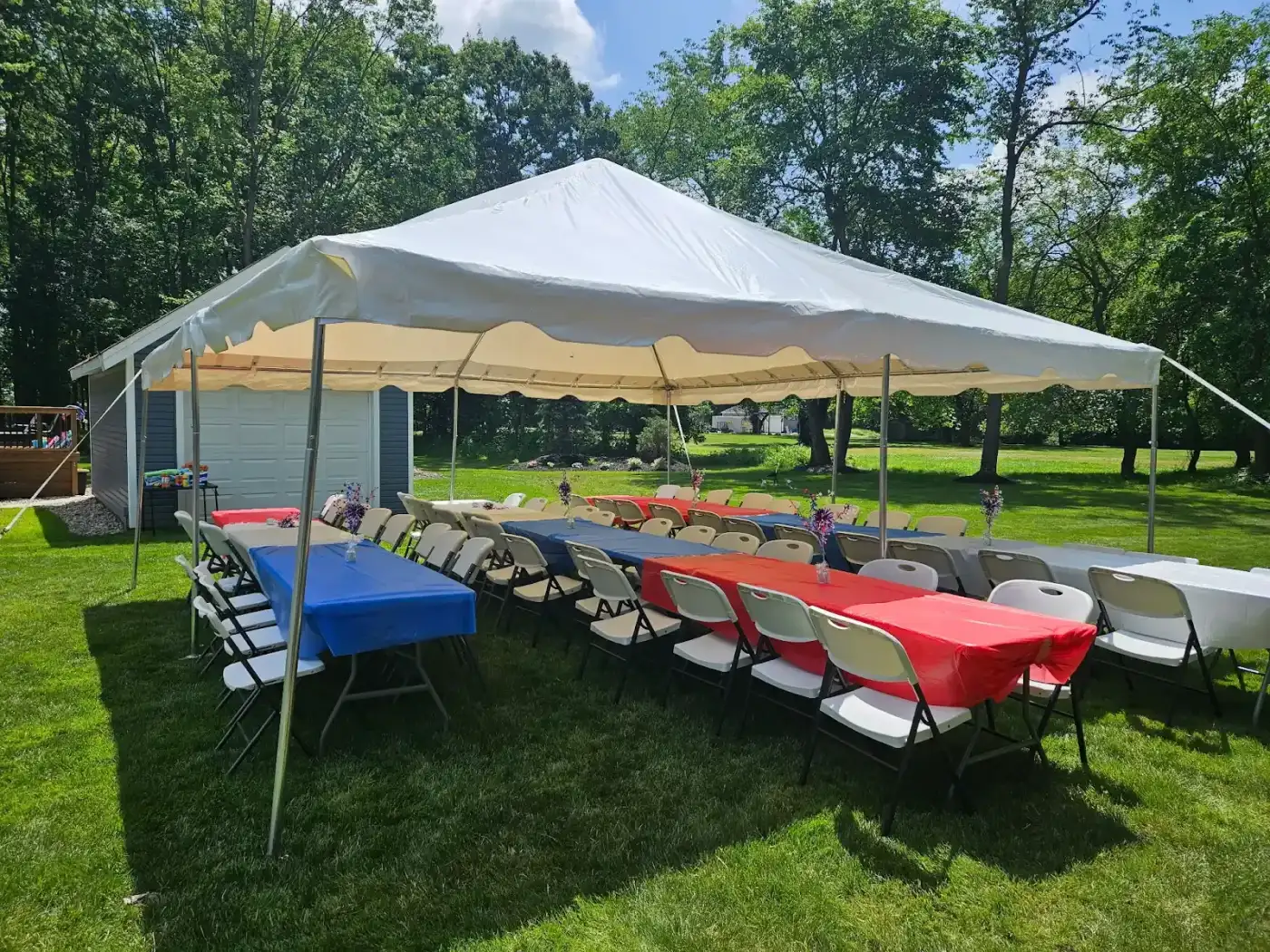 Tables arranged beneath the tent in Avon, a Shoreline project